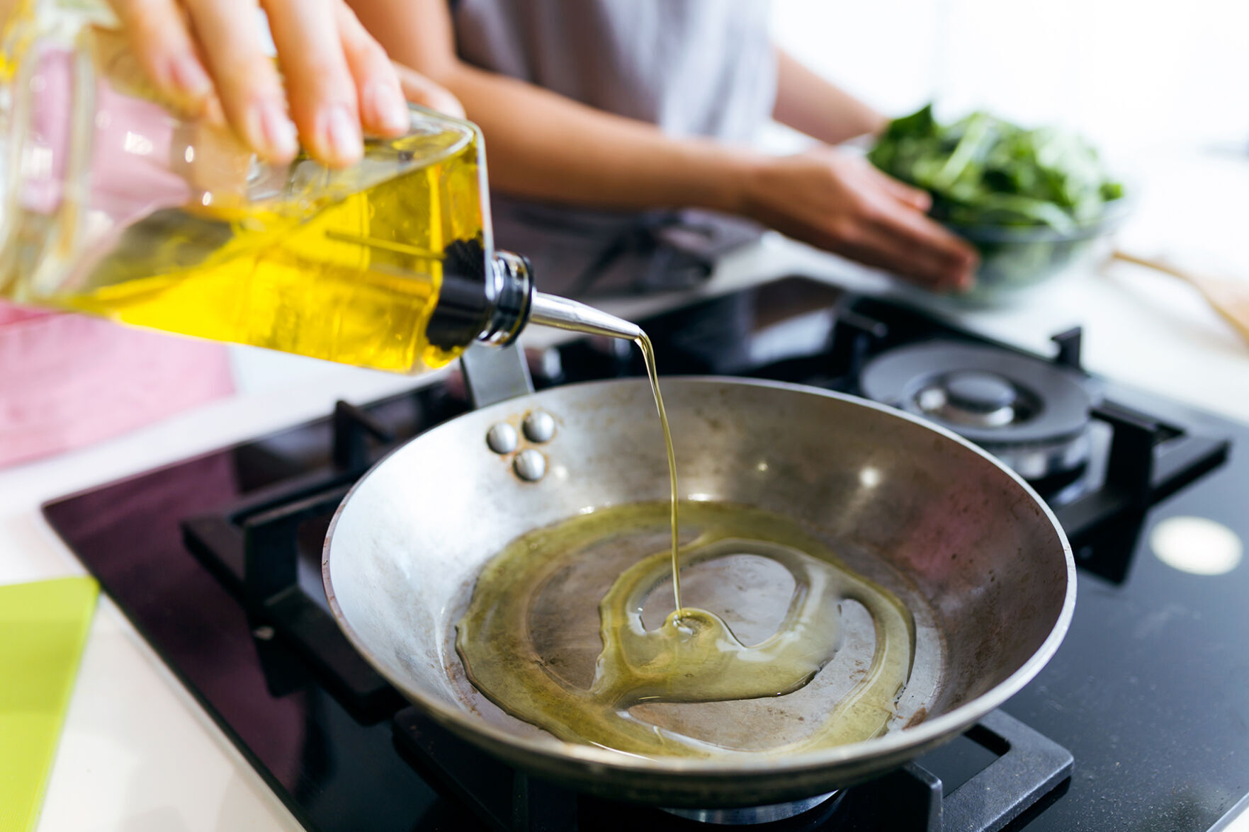 Pouring oil into pan